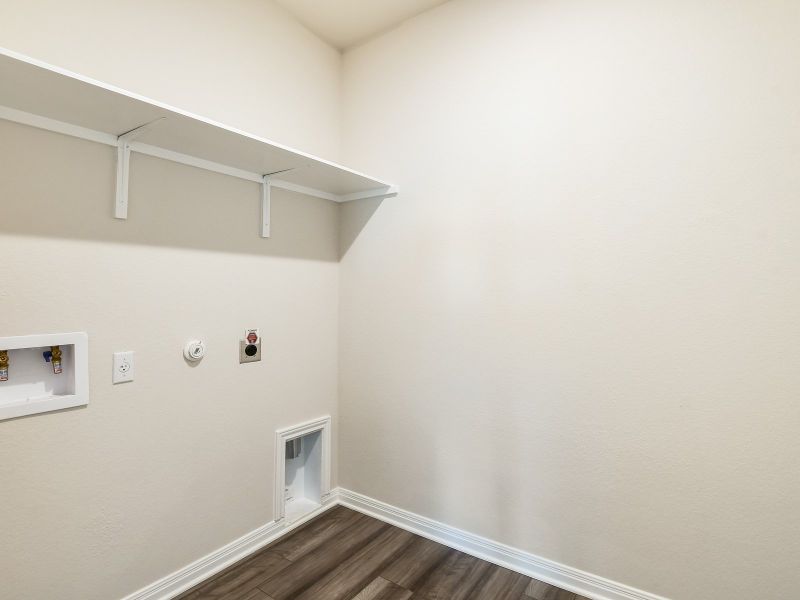 The downstairs laundry room helps make laundry day a breeze.
