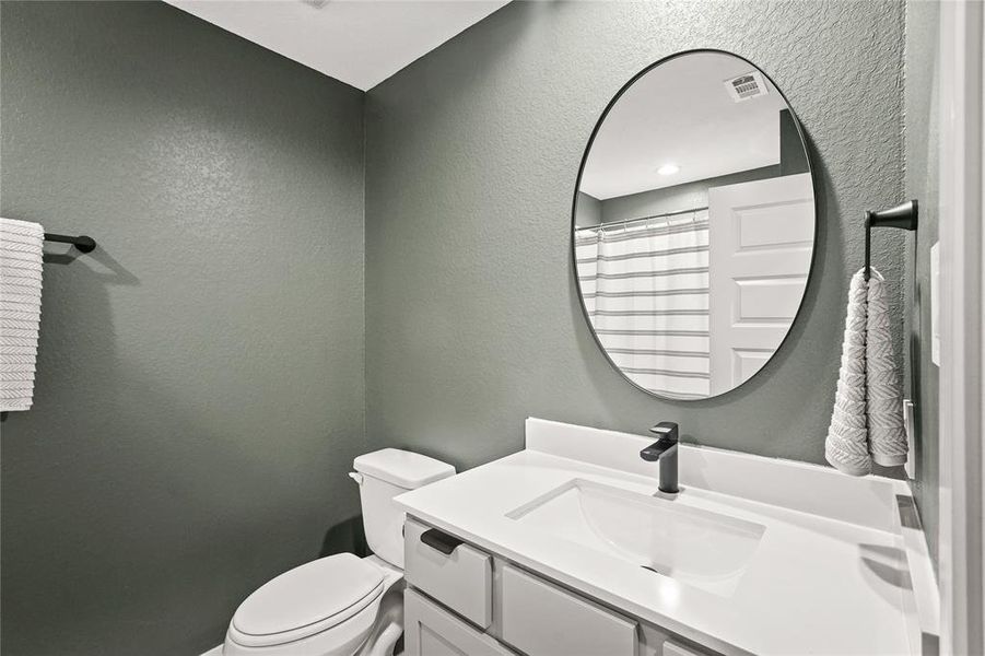 Full guest bathroom with modern vanity and fixtures