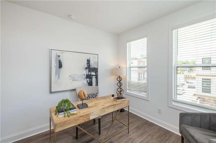 Secondary Bedroom  with dark hardwood / wood-style flooring and plenty of natural light, not the actual unit