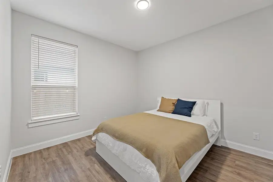 Bedroom featuring hardwood / wood-style flooring