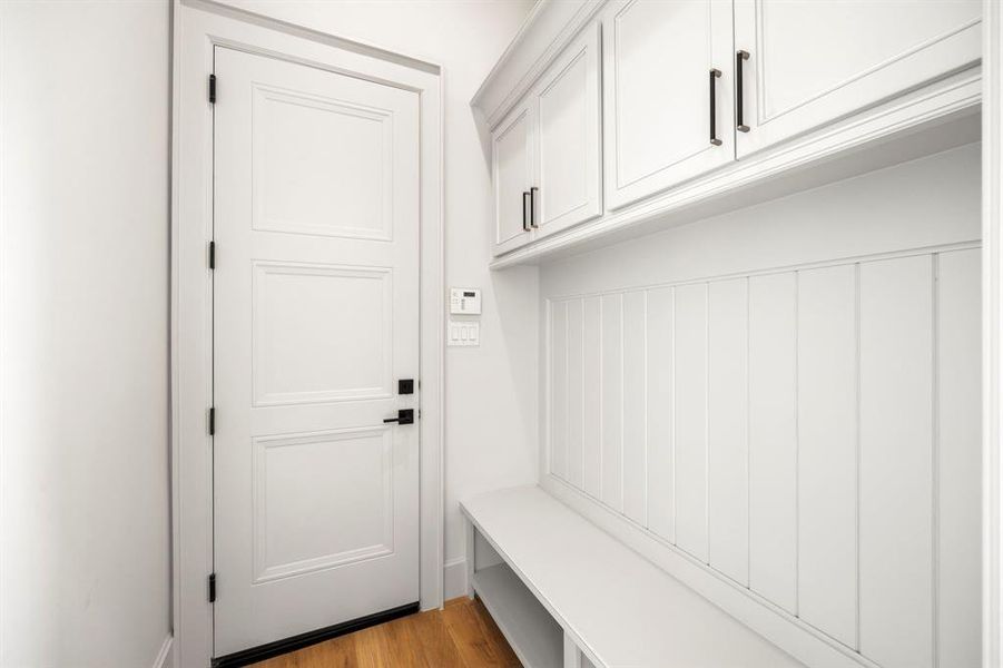 behind the Butler's Pantry is the Mudroom leading from the garage.
