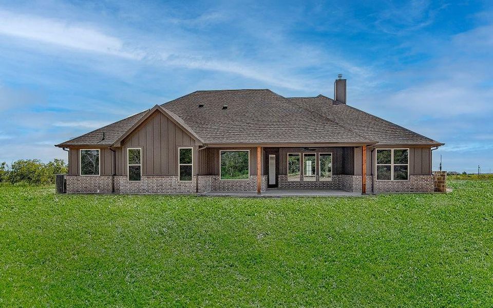 Back of property with a patio area and a yard