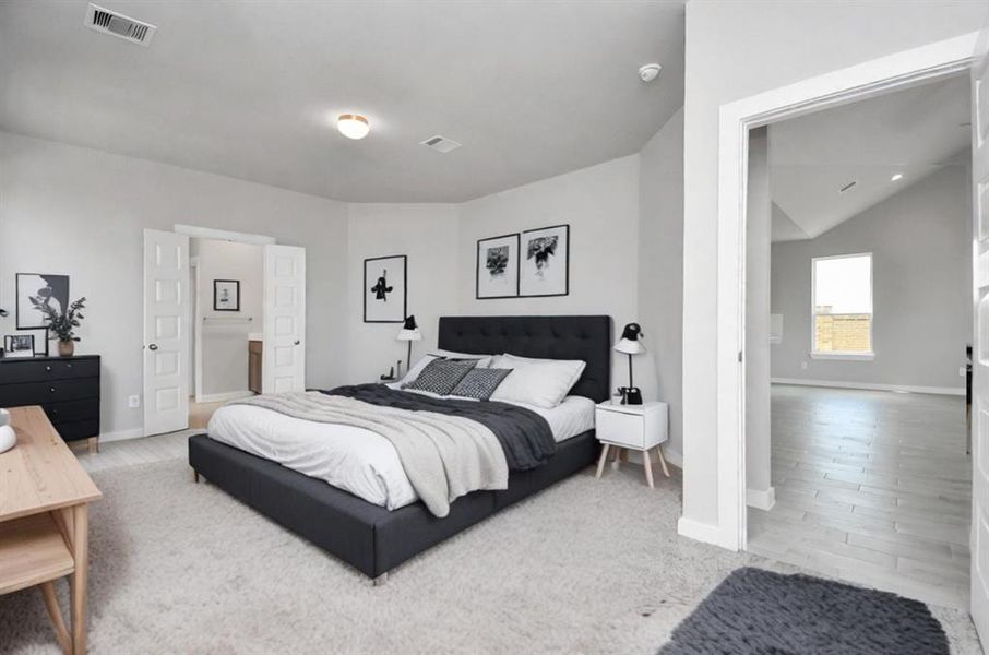 Escape to tranquility in this spacious primary room, adorned with plush carpeting and bathed in the soothing hues of warm paint colors, creating a cozy retreat for relaxation. Sample photo, virtually staged.