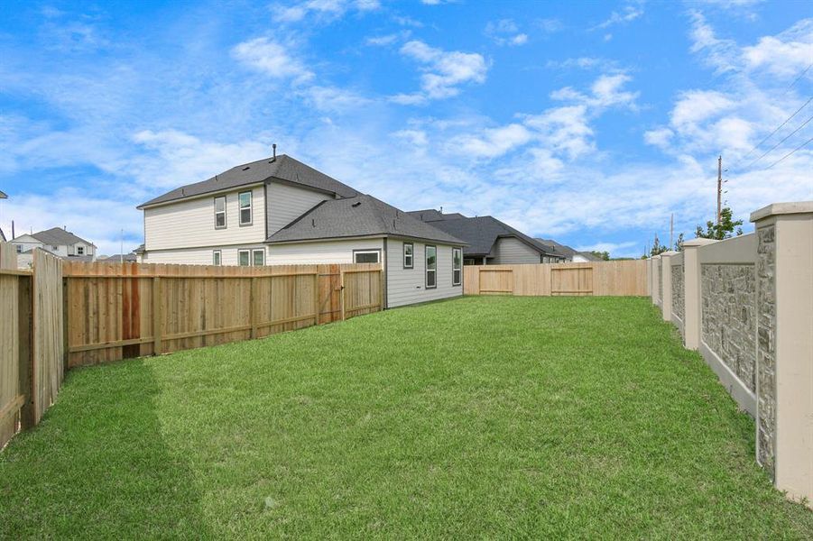 Come and see this spacious backyard with its beautiful covered patio. There is plenty of room for the kids to play and adults to relax. Perfect for your outdoor living space, patio furniture, bbq pit, and so much more. The possibilities are endless!