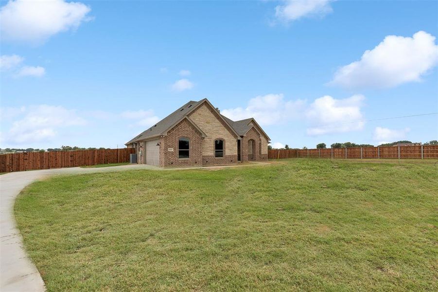 View of front of house featuring a front lawn