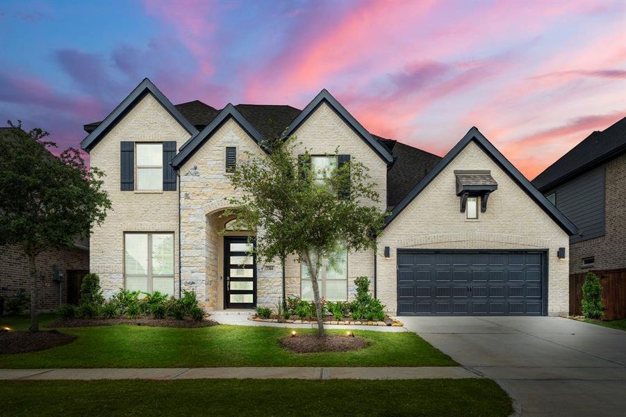 Welcome home to 7314 Autumn Sage! This stunning 2 story home welcomes you with sensational curb appeal, lush landscaping, and a well-maintained yard. It features an elegant exterior with cream brick and stone, contrasting dark trim, and a spacious 3 car garage!