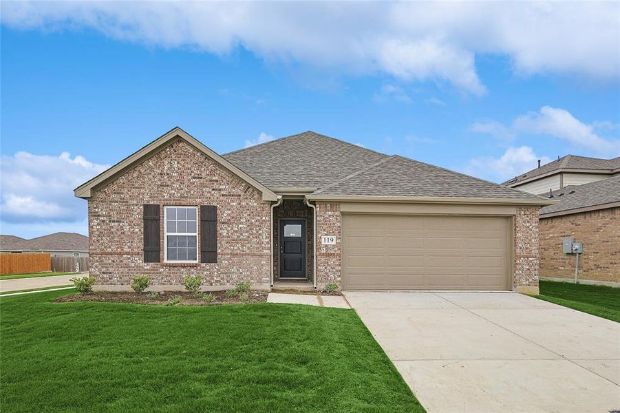 View of front of home with a front lawn and a garage