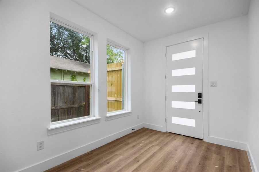 Entrance foyer featuring light hardwood / wood-style floors