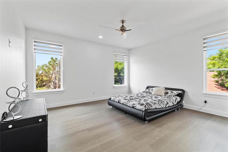 Bedroom featuring light wood-type flooring and ceiling fan