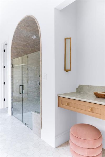 Bathroom with tile patterned flooring and an enclosed shower