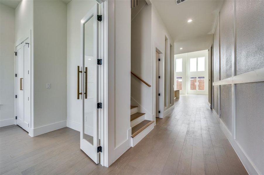 Hall with light hardwood / wood-style flooring