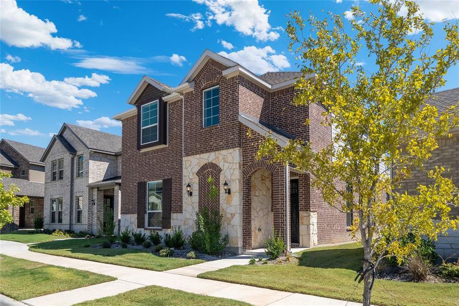 View of front of property with a front lawn