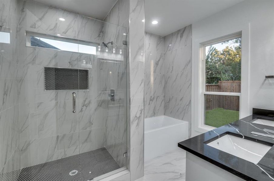 Master Bathroom with dual sinks and attached walk in closet along with a large stand up shower with a frameless glass door!  Upgraded Tub! Plenty of natural lighting!!!