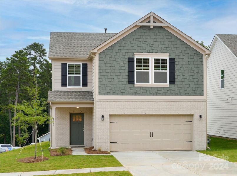 Home is located on a corner lot with pond views.