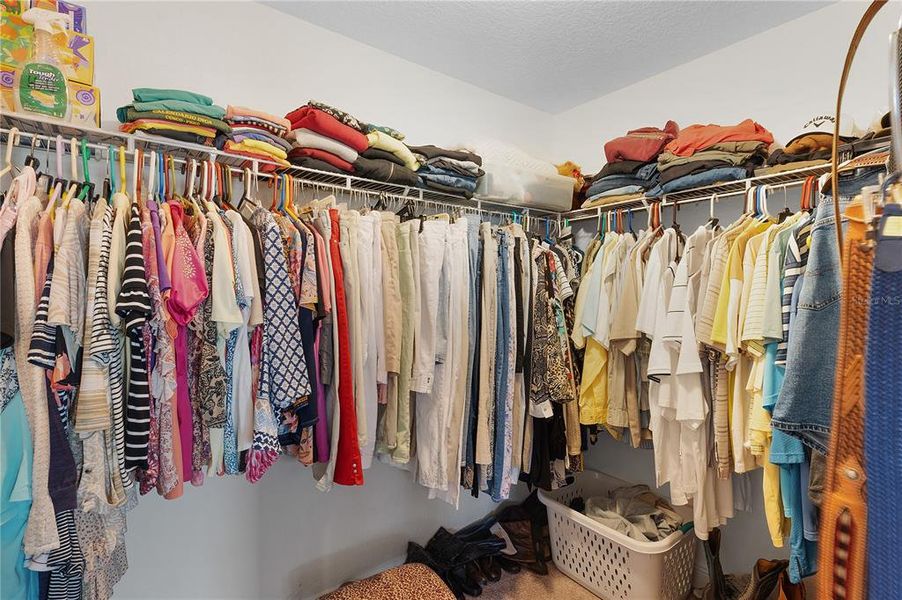 A Peek at the Primary Walk-In Closet.