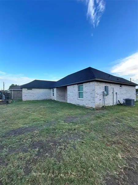 View of property exterior with cooling unit and a yard