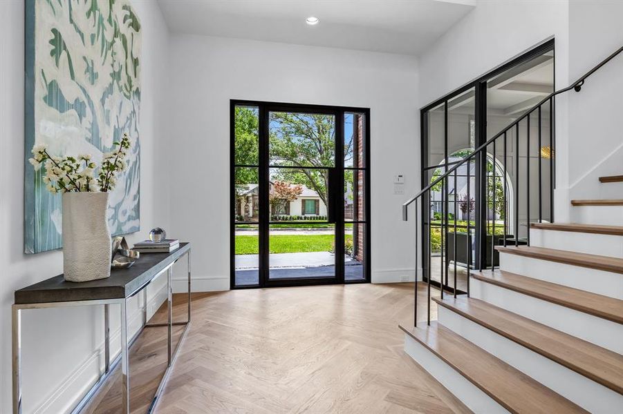 Doorway featuring light parquet floors