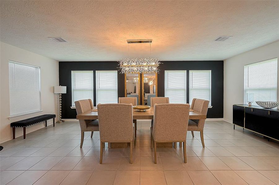 Dining room with custom light fixture