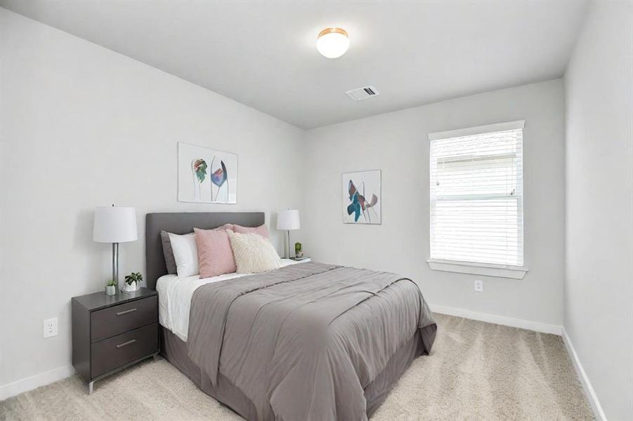 Generously sized secondary bedrooms, complete with spacious closets and soft, inviting carpeting.