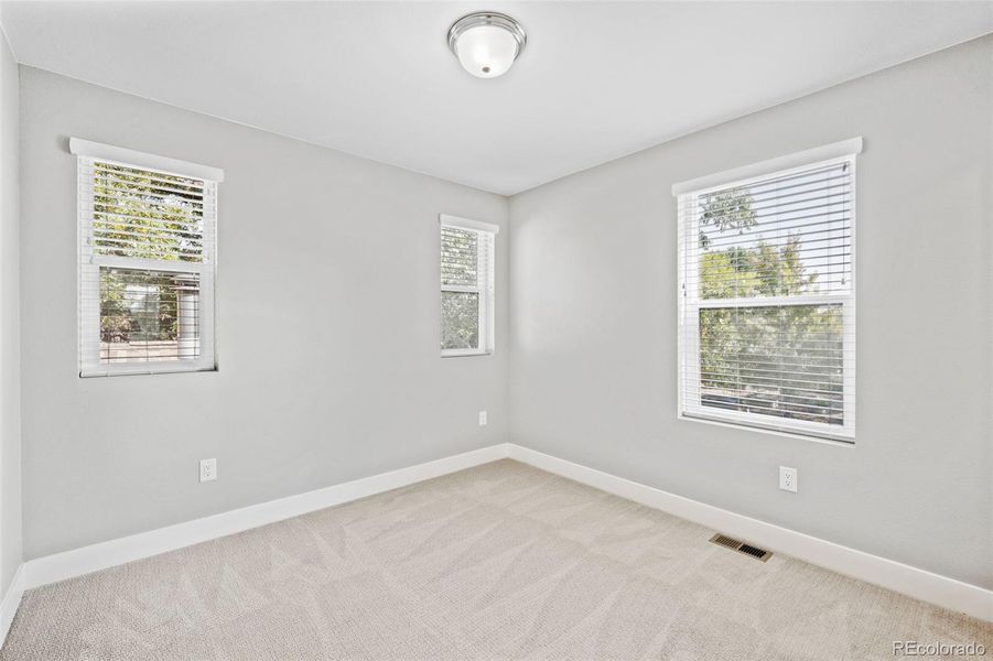 Second upstairs bedroom is light and bright.