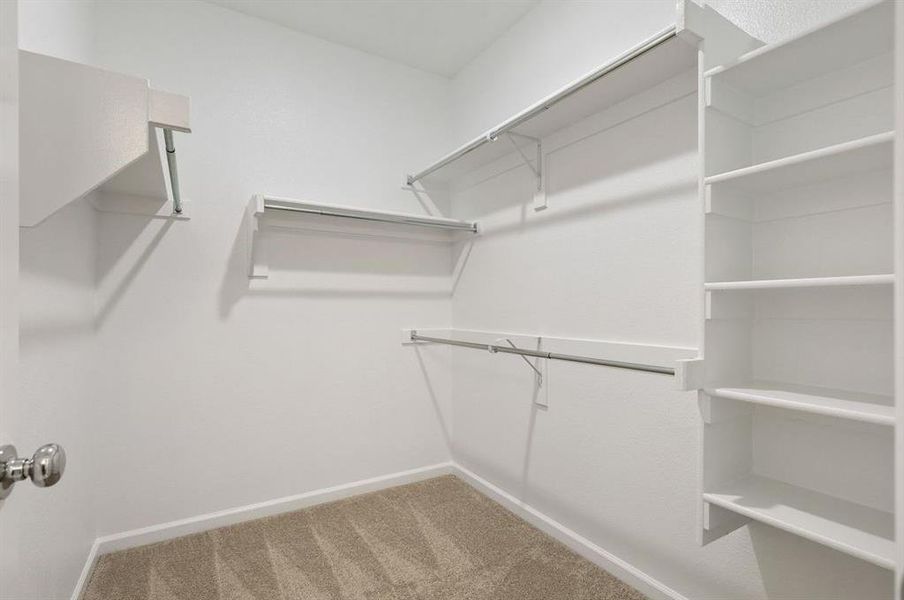 Primary closet in the Pulitzer home plan by Trophy Signature Homes – REPRESENTATIVE PHOTO