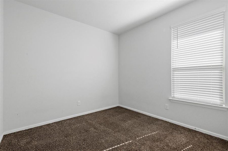 Spare room with carpet floors