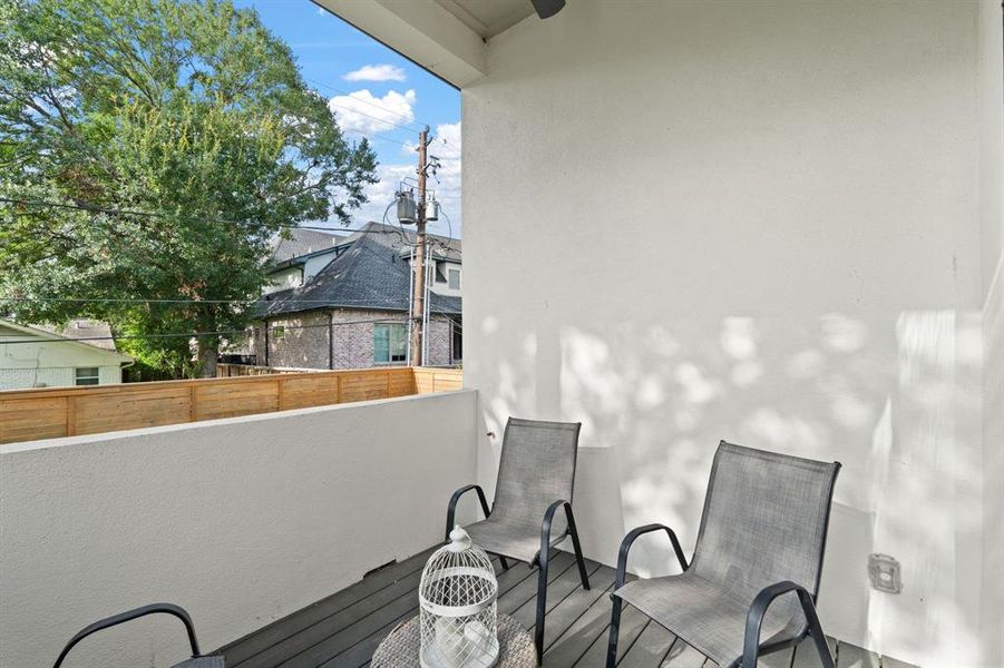 Private balcony off of the Primary Suite offering breathtaking views of the beautifully landscaped backyard.