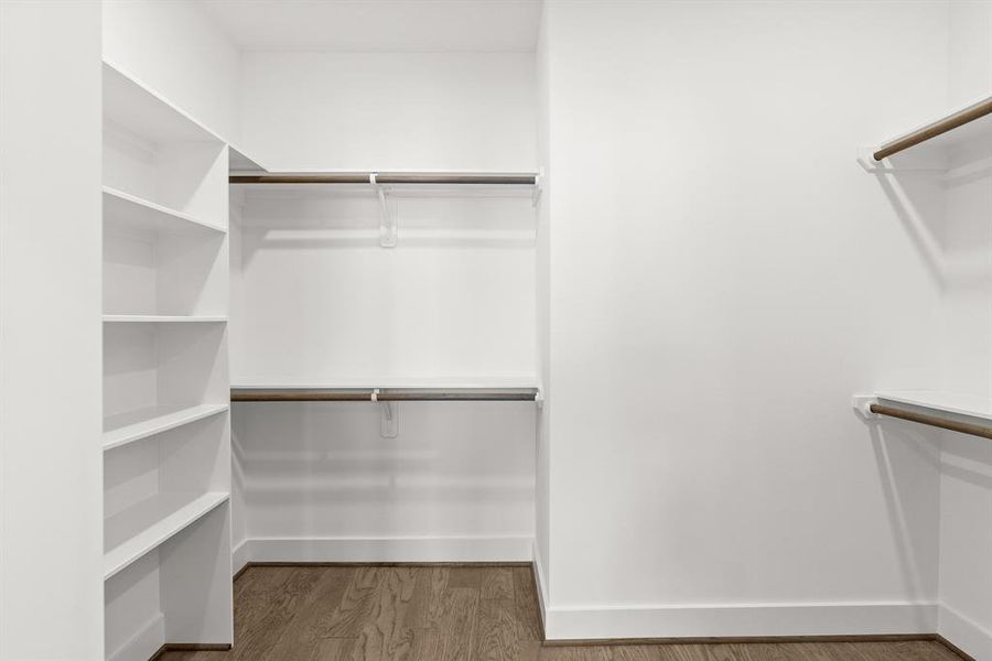 A organizers dream with walk in closet and custom shelve.