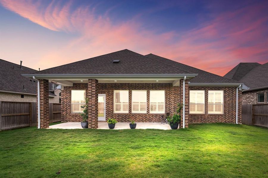 Come and see this spacious backyard with its beautiful covered patio. There is plenty of room for the kids to play and adults to relax!