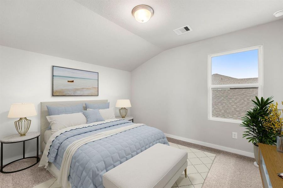 Secondary bedroom features plush carpet, neutral paint, large window and ample closet space.