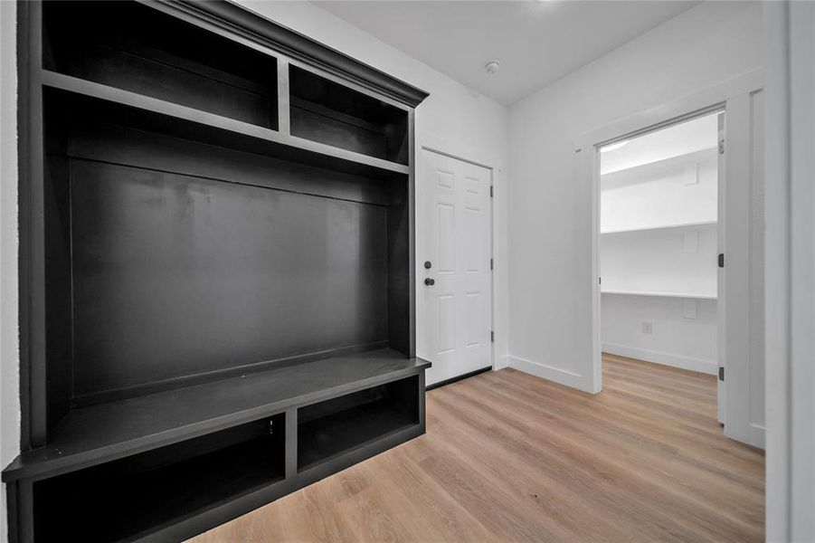 Mudroom featuring wood-type flooring