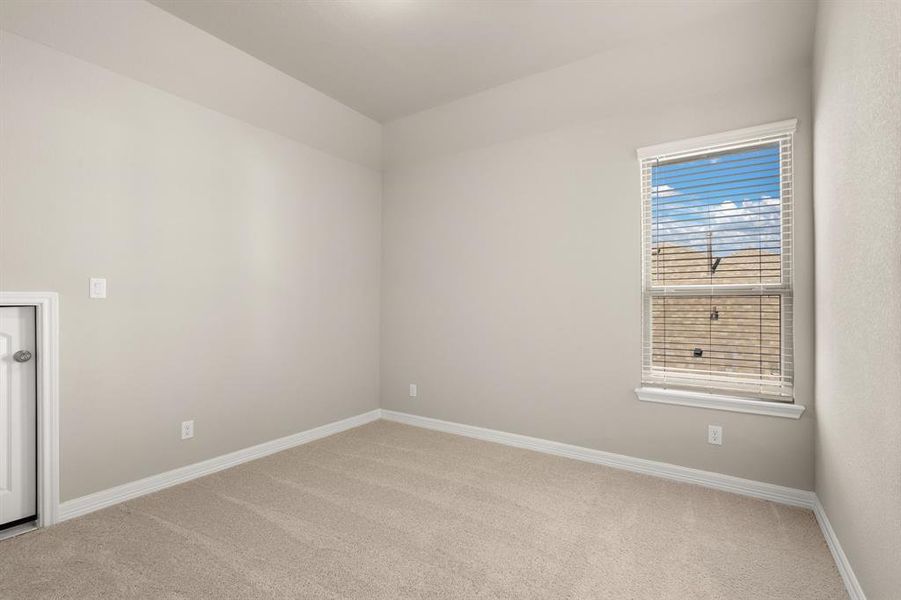 Your secondary bedroom features plush carpet, fresh paint, closet, and a large window that lets in plenty of natural lighting.