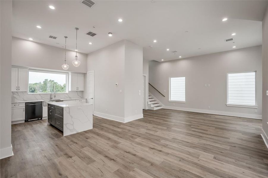Open floor plan throughout the kitchen, dining and living areas.