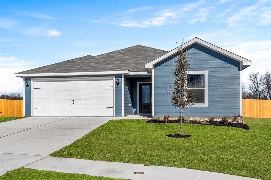 Ranch-style home with a front lawn and a garage