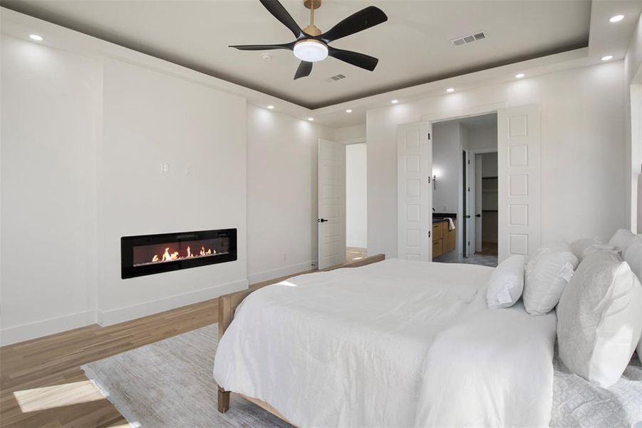 Bedroom with light wood-type flooring and ceiling fan