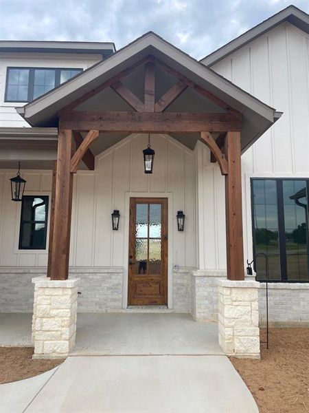 Property entrance with covered porch