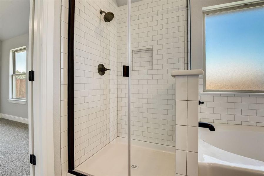 Bathroom featuring independent shower and bath