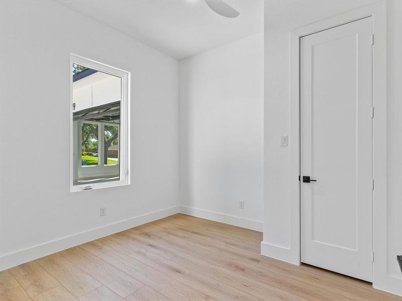 Unfurnished room featuring ceiling fan and light hardwood / wood-style floors