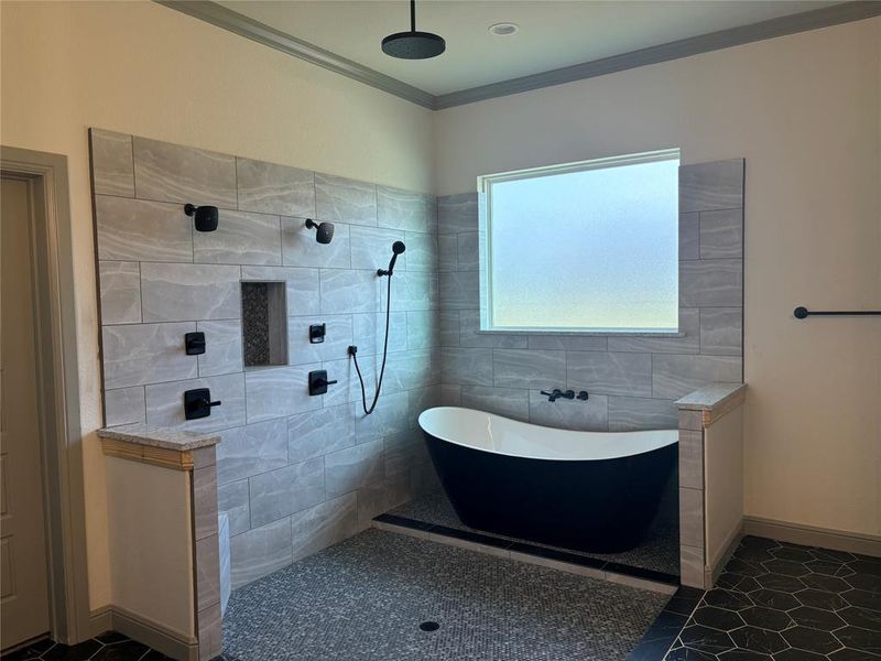 Bathroom with separate shower and tub, tile walls, crown molding, and tile patterned flooring