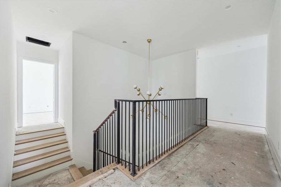 View from the 2nd floor landing toward the gameroom private entry.  This great space is located over the garage and the perfect spot to host watch parties and game nights without guests having to pass by your personal 2nd floor living spaces.  Photo as of 9/3/2024