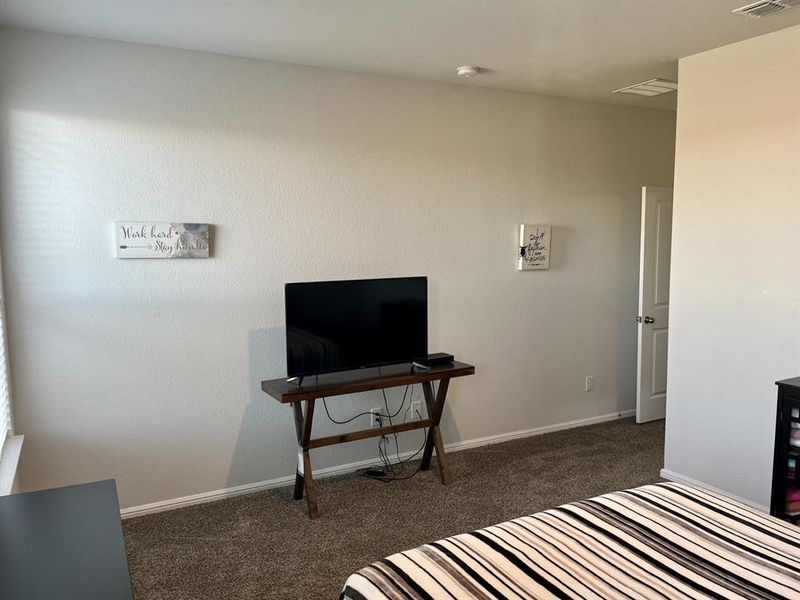 Bedroom with dark carpet