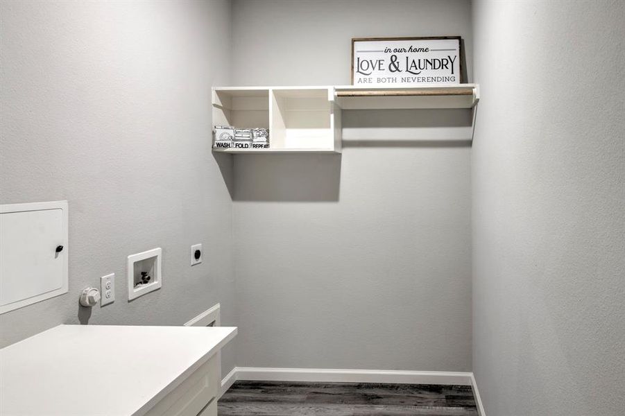 Laundry area featuring washer hookup, hookup for an electric dryer, and dark hardwood / wood-style flooring