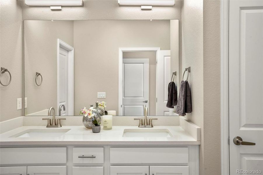 Primary bathroom with linen closet, private WC and shower