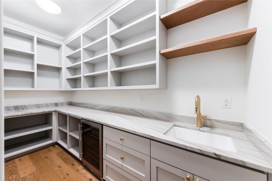 Spacious pantry with wine refrigerator