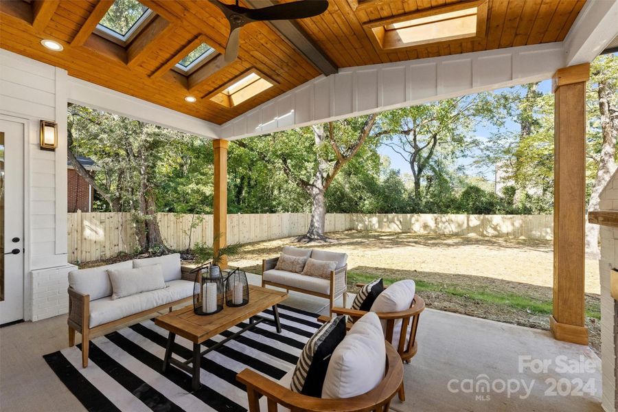 Covered back patio with skylights and fireplace