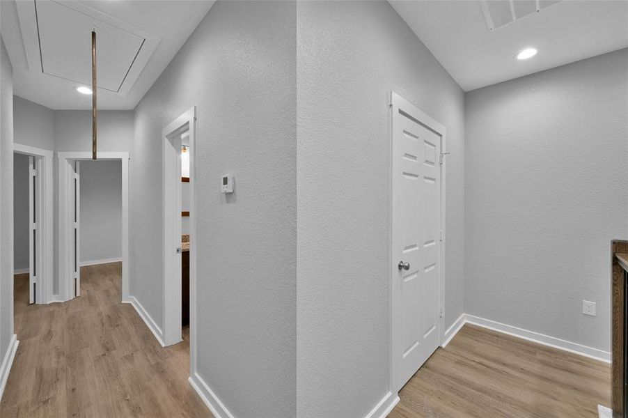 Hallway leading to bedrooms and utility room