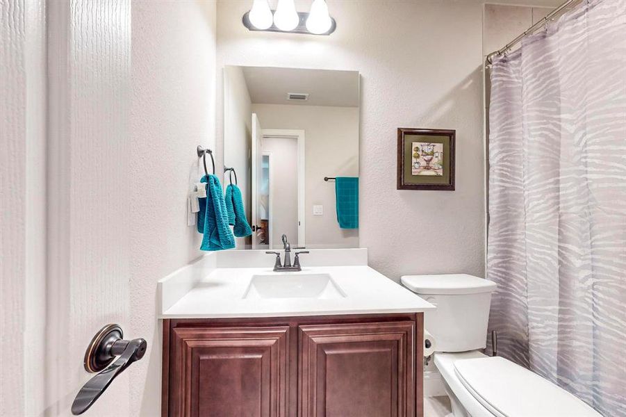 Bathroom with vanity and toilet