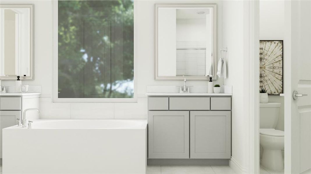 Bathroom featuring vanity, tile patterned flooring, toilet, and a bathing tub