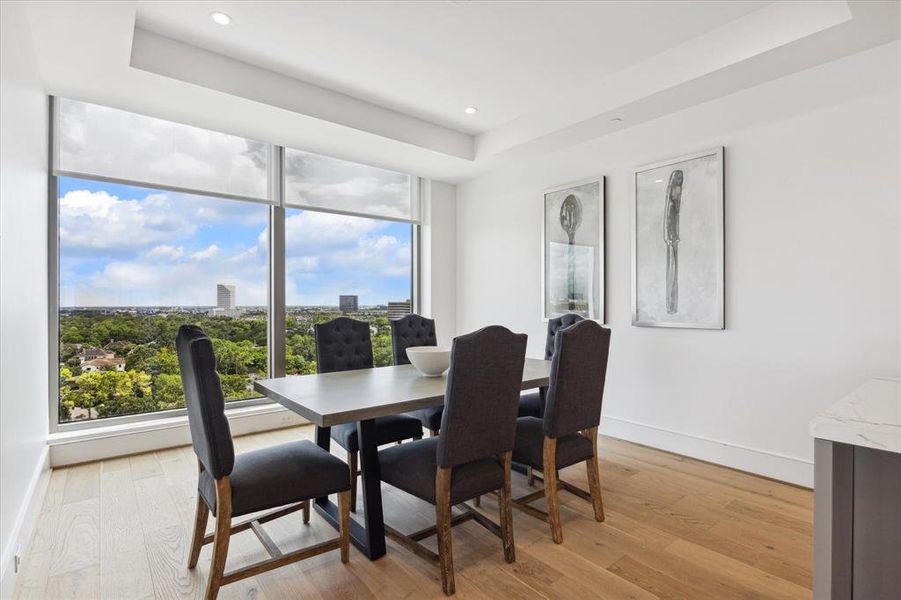 The breakfast room has plenty of space for all to sit and to hang your artwork.