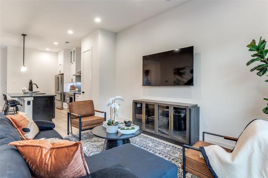 Living room featuring light hardwood / wood-style floors and sink